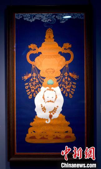 圖為5月16日，展覽中的新創(chuàng)唐卡作品《瑞象承香》?！±盍?攝
